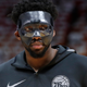 Illustration for article titled Is Joel Embiids Mask More Superhero Or Supervillain?